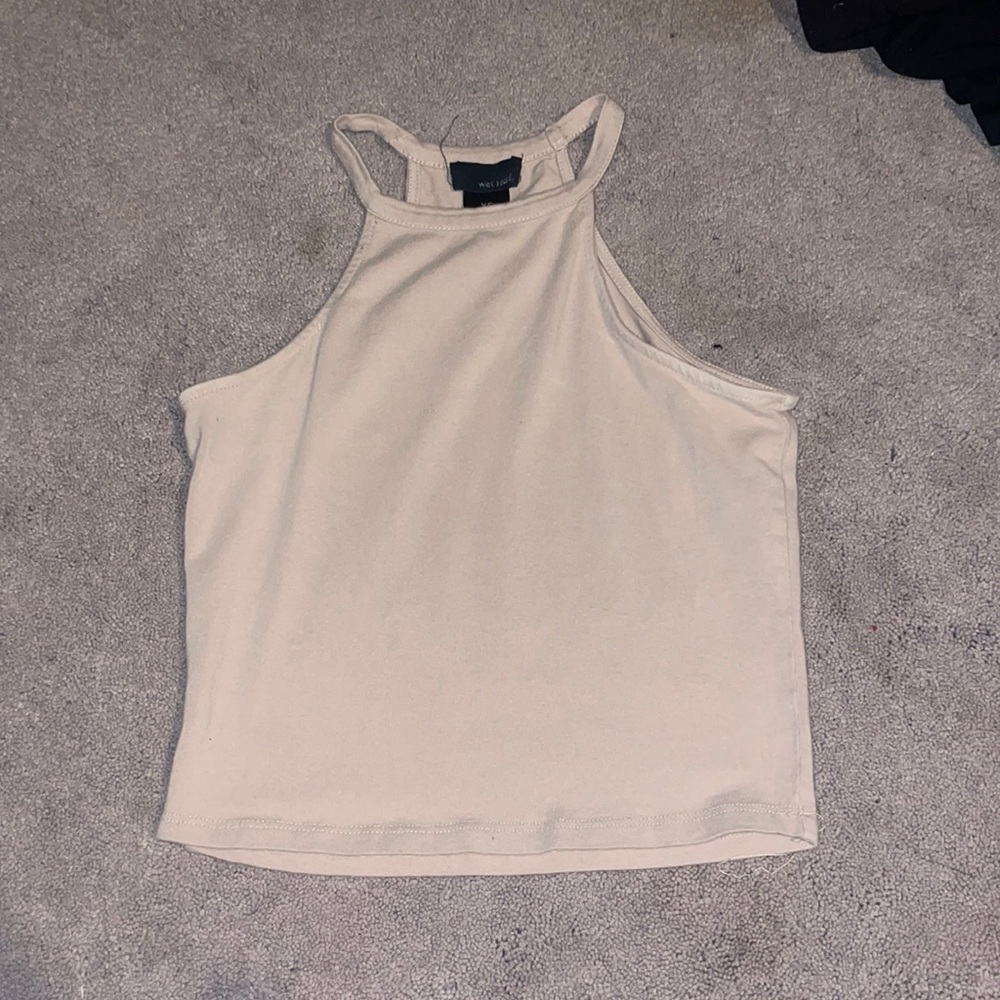 This halter top is from wetseal! It is like a beige nude color with a size XS!